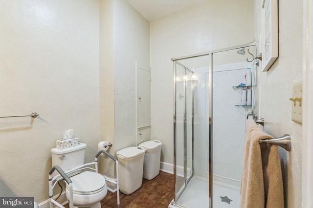 bathroom with toilet and walk in shower