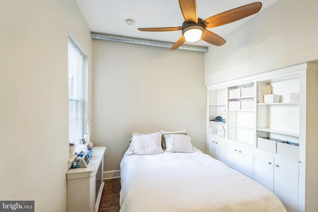 bedroom featuring dark wood-type flooring and ceiling fan