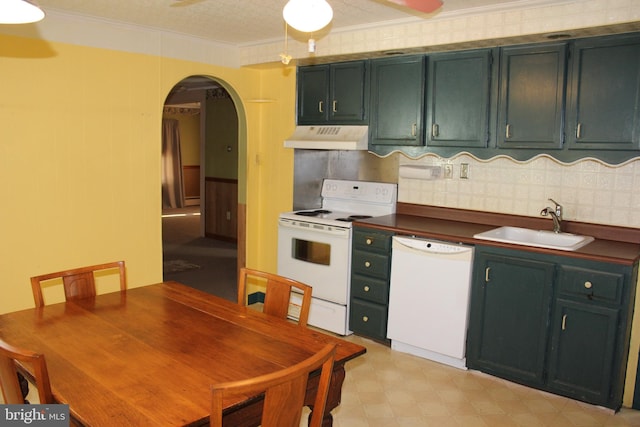 kitchen with white appliances, crown molding, a textured ceiling, and sink