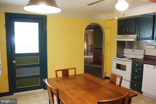 dining space with crown molding, a textured ceiling, and ceiling fan