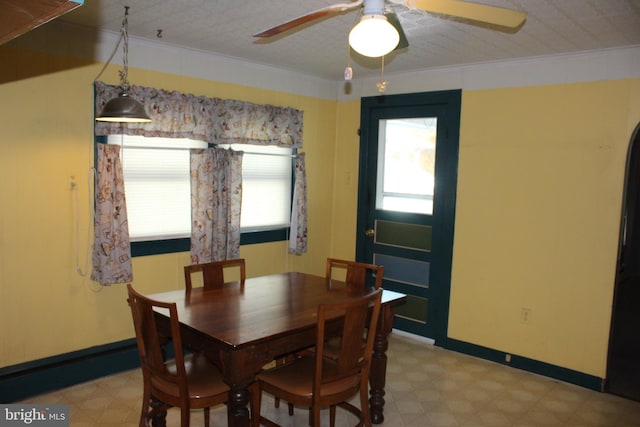 dining space featuring ornamental molding, a healthy amount of sunlight, and ceiling fan