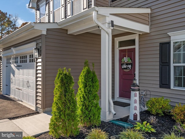 property entrance with a garage