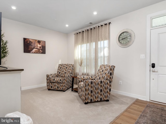 living area featuring light hardwood / wood-style floors