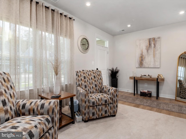 living area with hardwood / wood-style floors