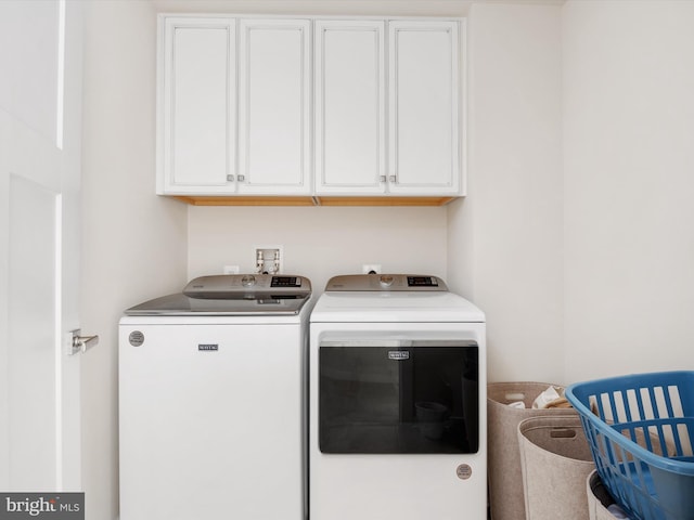 laundry area with cabinets and independent washer and dryer