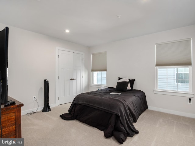 bedroom with light carpet