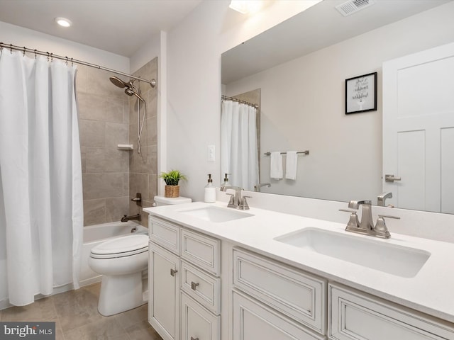 full bathroom with vanity, toilet, and shower / tub combo with curtain