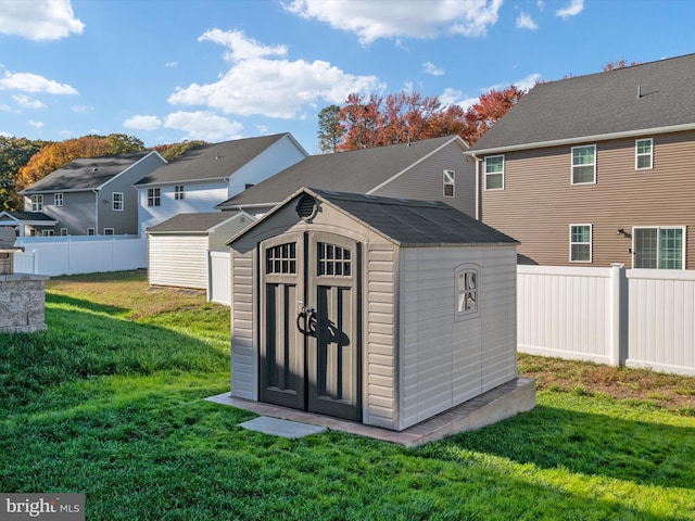 view of outdoor structure featuring a yard