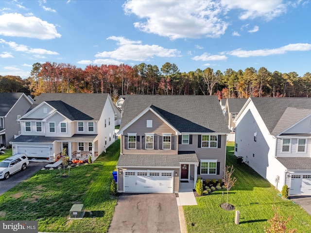 view of front facade featuring a garage and a front lawn