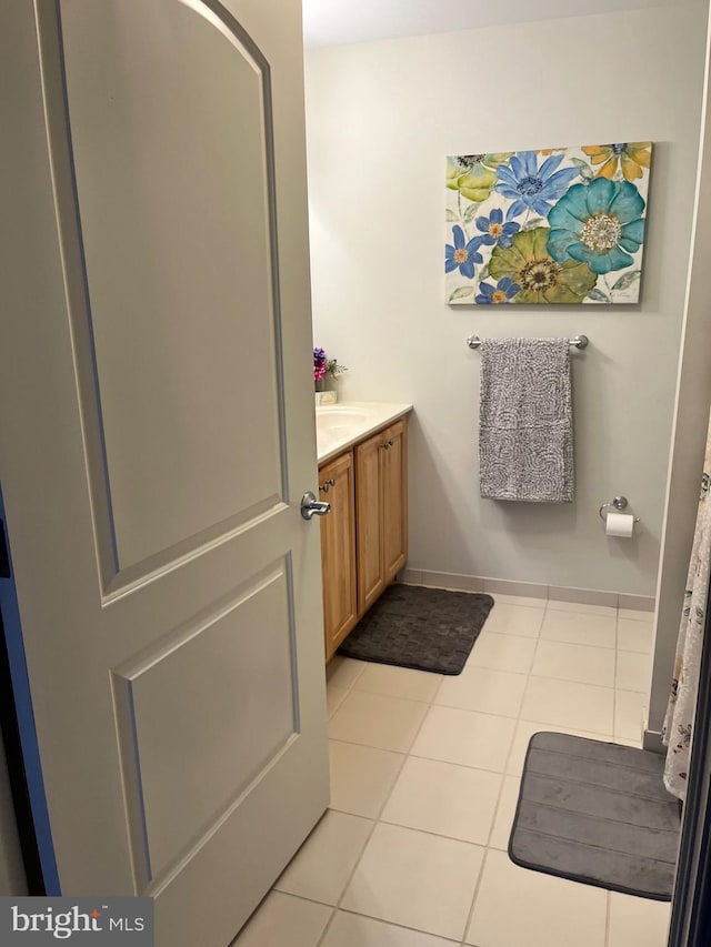 bathroom with vanity and tile patterned flooring