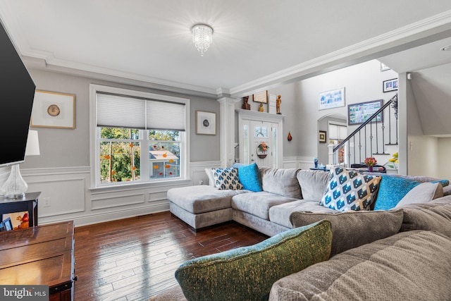 living room featuring dark wood-type flooring and ornamental molding