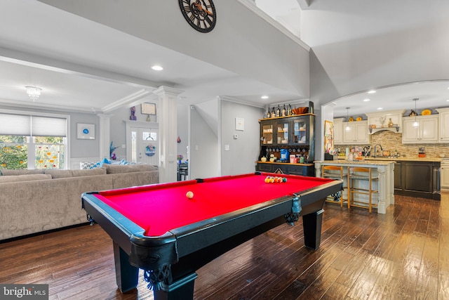 recreation room with pool table, crown molding, decorative columns, and dark hardwood / wood-style flooring