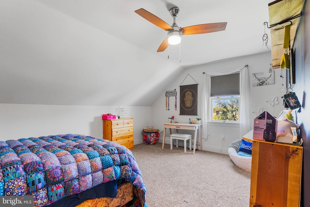 bedroom with vaulted ceiling, carpet flooring, and ceiling fan