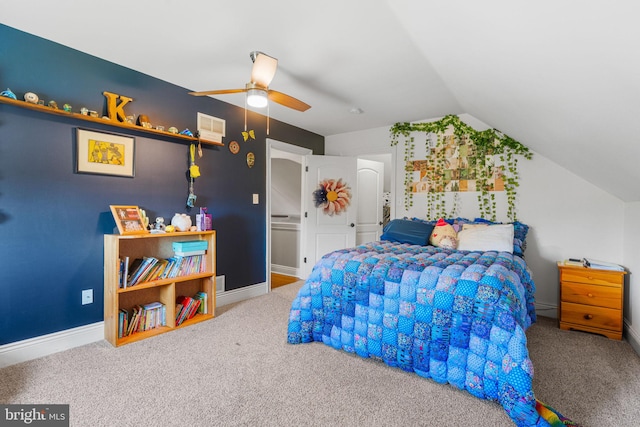 carpeted bedroom with vaulted ceiling and ceiling fan