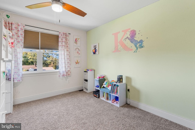 playroom with carpet floors and ceiling fan