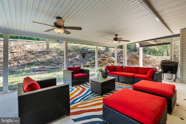 sunroom / solarium featuring ceiling fan