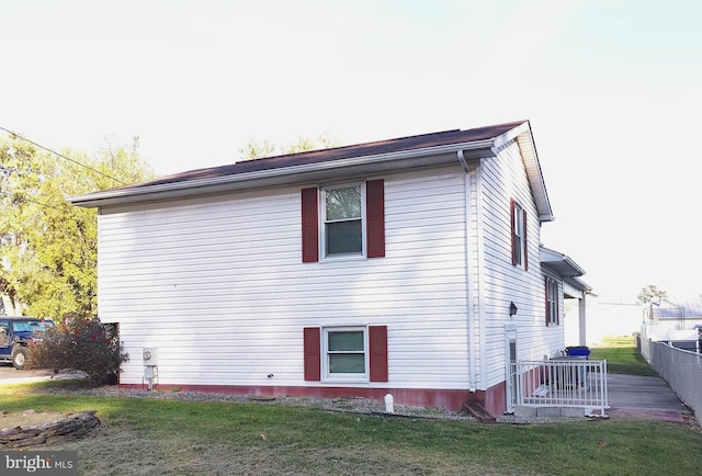 view of home's exterior with a yard