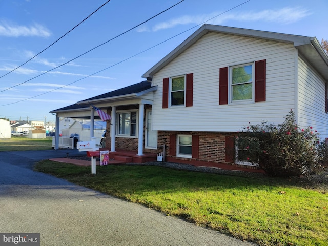 split level home with a front yard