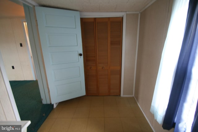 hall with light tile patterned flooring