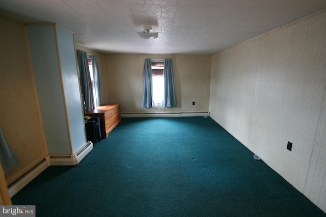 empty room featuring dark colored carpet and a baseboard radiator