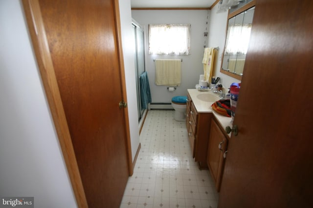 bathroom featuring crown molding, walk in shower, vanity, a baseboard heating unit, and toilet