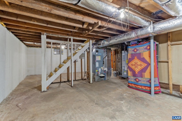 basement with water heater and heating unit