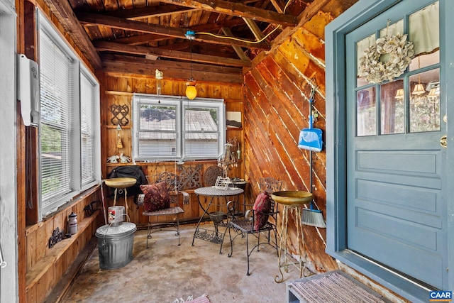 sunroom / solarium featuring vaulted ceiling