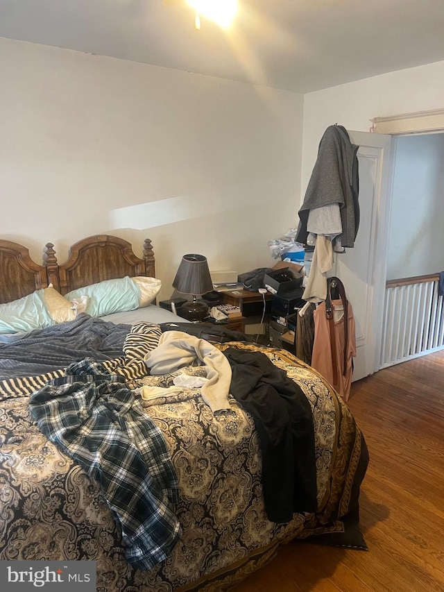 bedroom featuring wood-type flooring