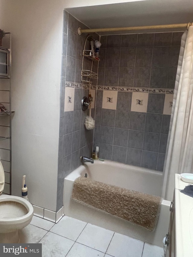 full bathroom featuring vanity, toilet, shower / bathtub combination with curtain, and tile patterned floors