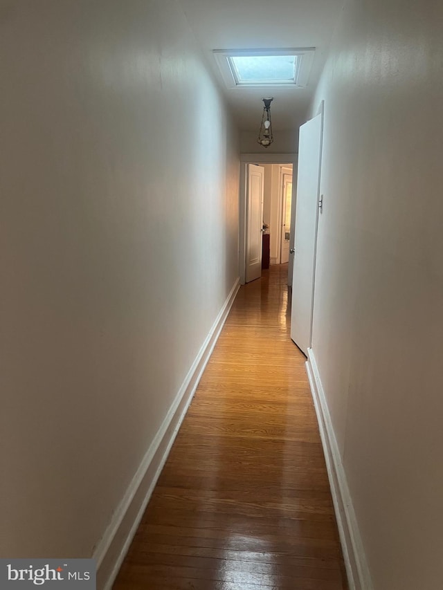 hallway with light wood-type flooring