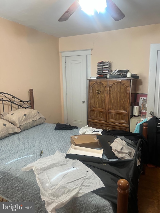 bedroom with hardwood / wood-style flooring and ceiling fan