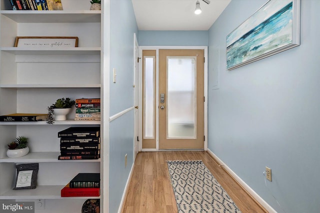 14301 Tunnel Ave Unit 2A, Ocean City, MD 21842 - doorway with wood finished floors and baseboards