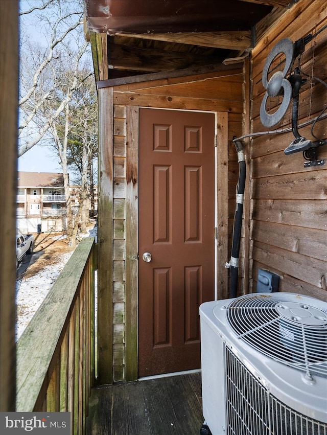 entrance to property featuring central AC and a balcony