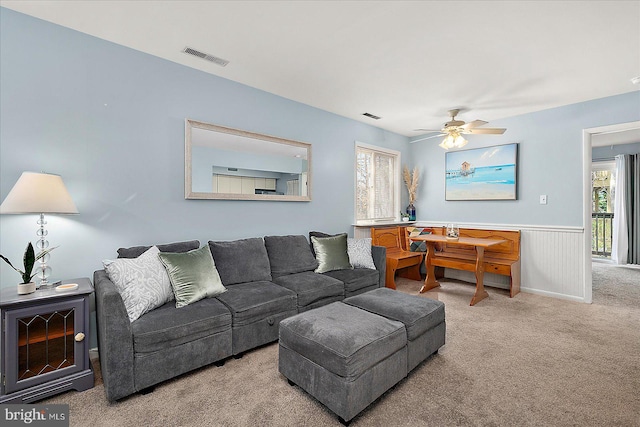 14301 Tunnel Ave Unit 2A, Ocean City, MD 21842 - living room with carpet floors, wainscoting, and ceiling fan