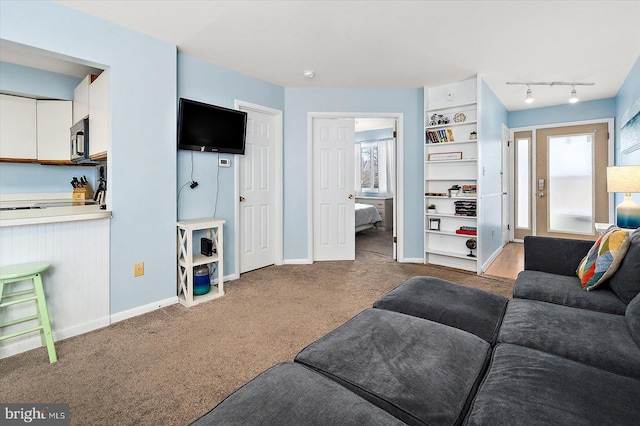 14301 Tunnel Ave Unit 2A, Ocean City, MD 21842 - living area with carpet flooring and baseboards