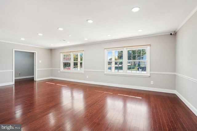 unfurnished room featuring dark hardwood / wood-style flooring and crown molding