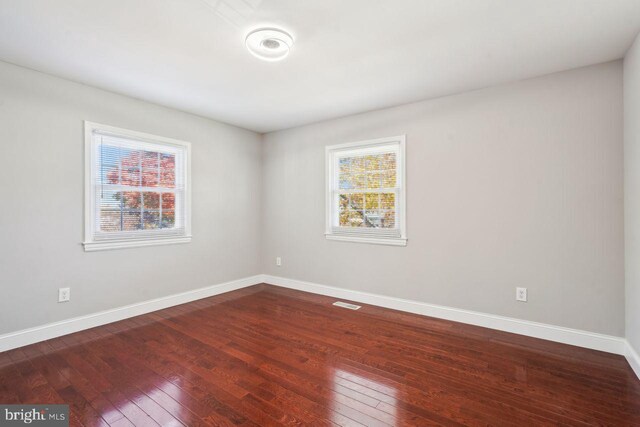 unfurnished room featuring hardwood / wood-style floors