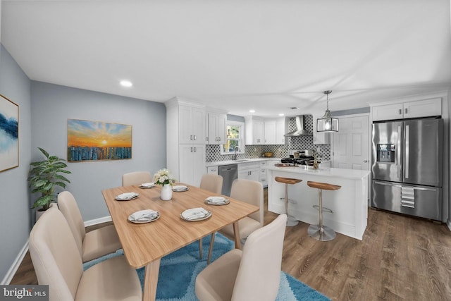 dining room with dark wood-type flooring and sink