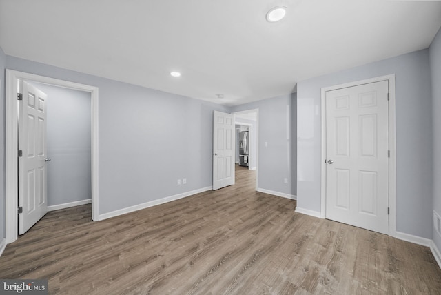 unfurnished bedroom with light hardwood / wood-style flooring