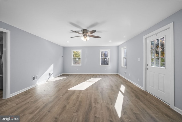 interior space featuring dark hardwood / wood-style floors and ceiling fan