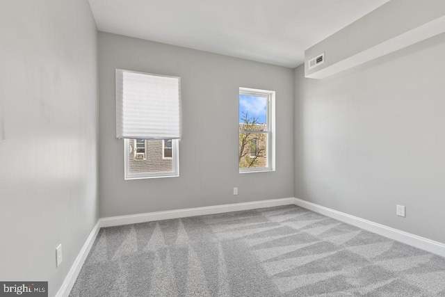 unfurnished room with carpet flooring