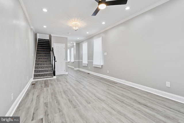 unfurnished living room with crown molding, light wood-type flooring, and ceiling fan