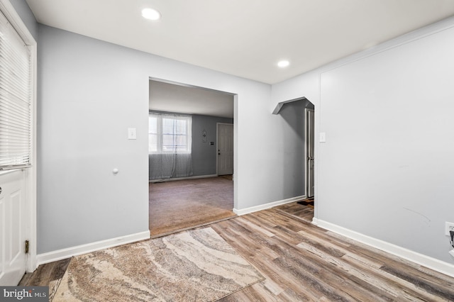 empty room featuring wood-type flooring