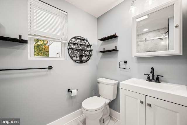 bathroom featuring vanity, a shower, toilet, and tile patterned flooring