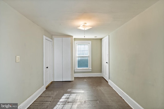 unfurnished room featuring dark hardwood / wood-style floors