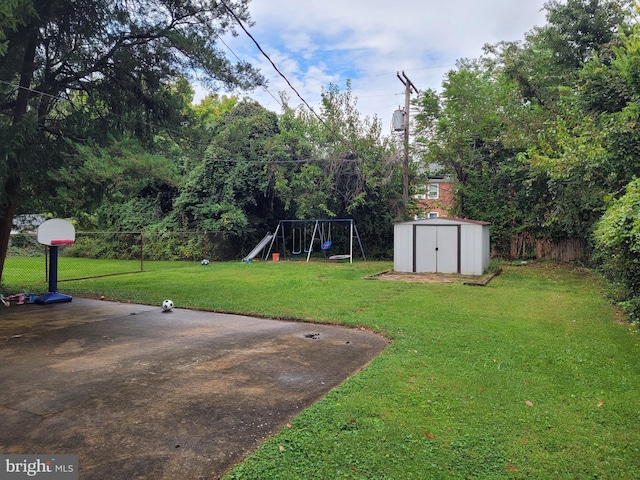 view of yard featuring a storage shed and a playground