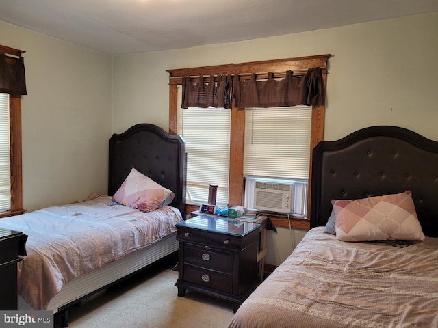 bedroom featuring cooling unit and light colored carpet