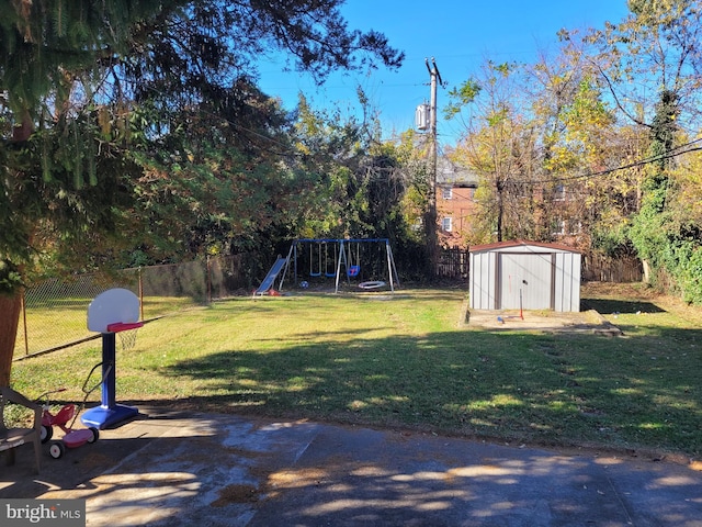 view of yard featuring a shed and a playground