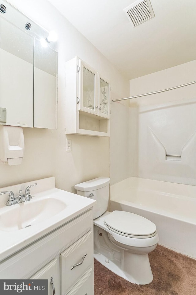 full bathroom with vanity, washtub / shower combination, and toilet