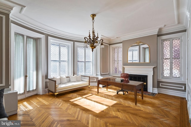 sitting room featuring an inviting chandelier, plenty of natural light, and light parquet floors